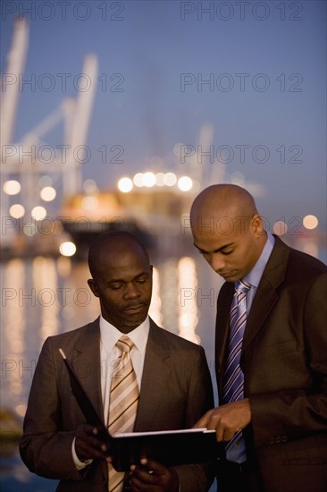 African American businessmen looking at paperwork