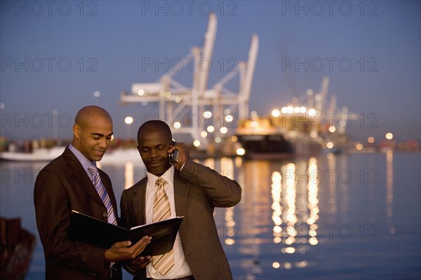 African American businessmen looking at paperwork
