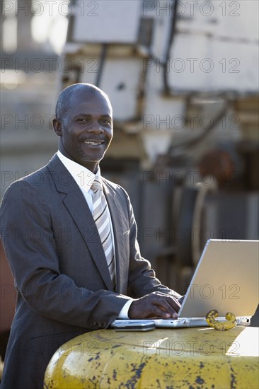 African American businessman typing on laptop