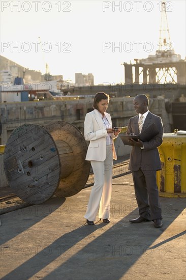 African American businesspeople on commercial pier