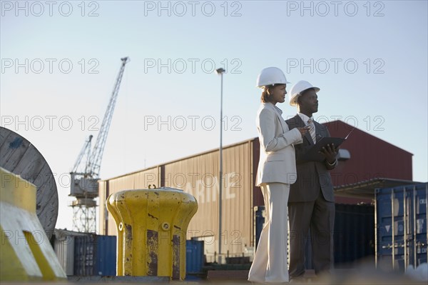 African American businesspeople at commercial pier