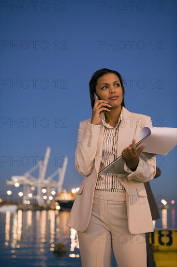 African American businesswoman talking on cell phone