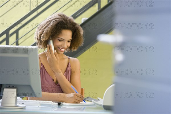 African businesswoman talking on telephone