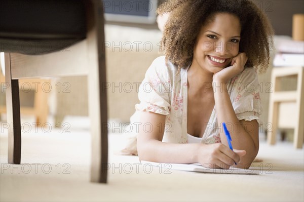 African woman writing on note pad