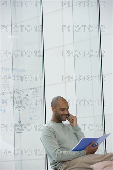 African businessman talking on cell phone