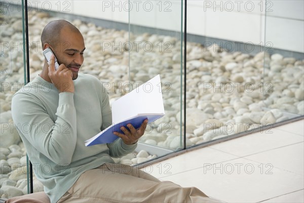 African businessman talking on cell phone