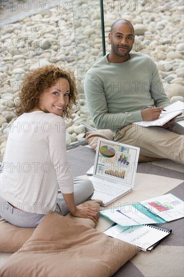 African businesspeople working on floor