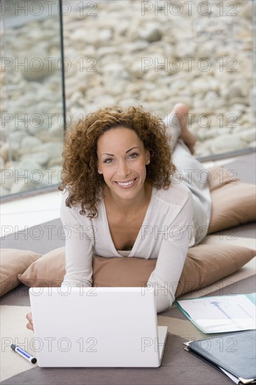 African businesswoman next to laptop