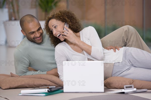 African couple working on floor