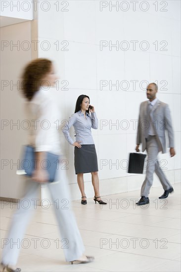 Asian businesswoman talking on cell phone