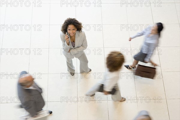 African businesswoman talking on cell phone