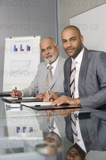 African businessmen at conference table