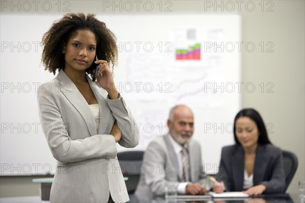 African businesswoman talking on cell phone