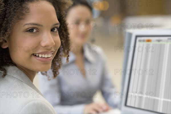 African businesswoman next to computer