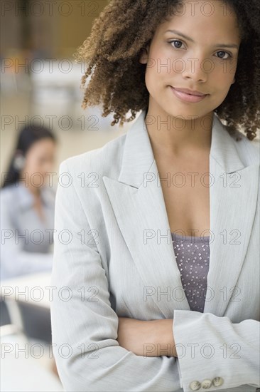 African businesswoman with arms crossed