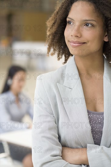 African businesswoman with arms crossed