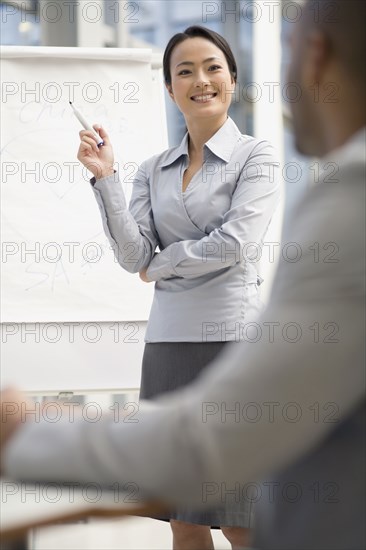 Asian businesswoman giving presentation