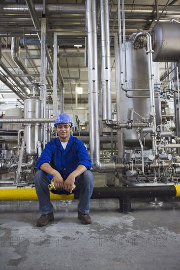 African worker sitting in factory