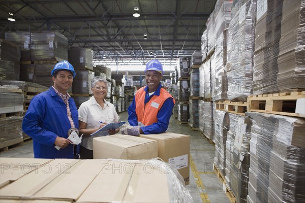 Workers smiling in warehouse