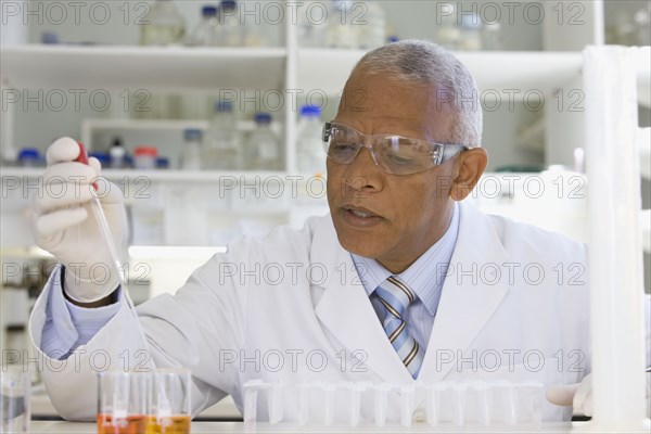 African scientist performing analysis in laboratory