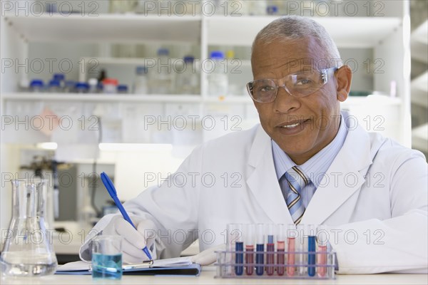 African scientist performing analysis in laboratory