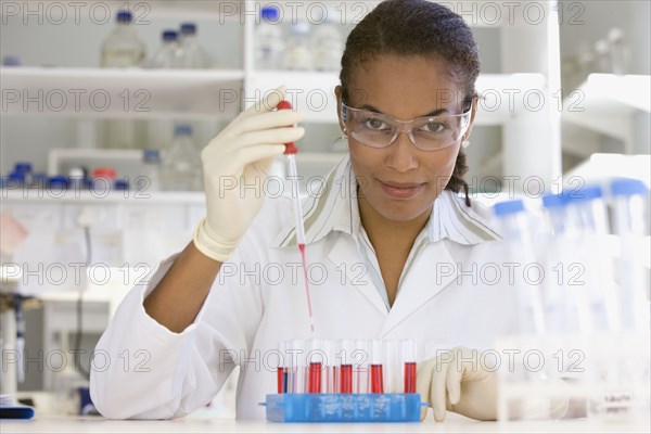 African scientist performing analysis in laboratory