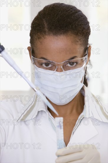 African scientist performing analysis in laboratory