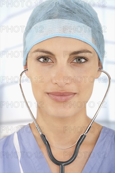 Mixed race doctor wearing scrubs in hospital