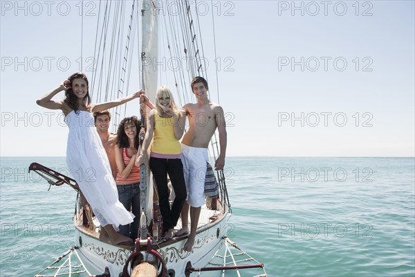 Caucasian friends on sailboat
