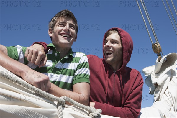 Caucasian men on sailboat