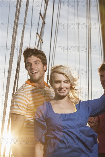 Caucasian friends on sailboat