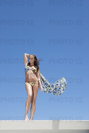 Caucasian woman wearing bikini outdoors