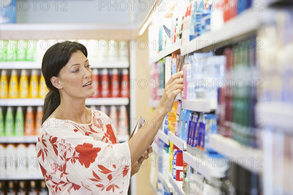 Caucasian woman shopping in drugstore