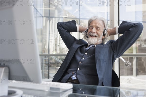 Senior Caucasian businessman talking on headset