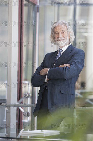 Senior Caucasian businessman smiling in office