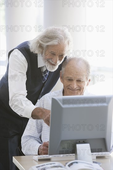 Senior Caucasian businessmen working together in office