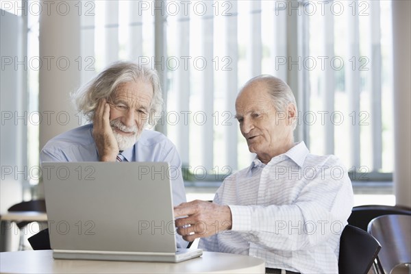 Senior Caucasian businessmen working together in office