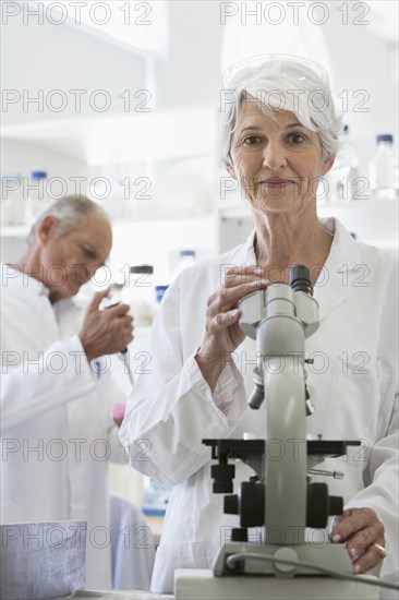 Senior Caucasian scientists working in lab