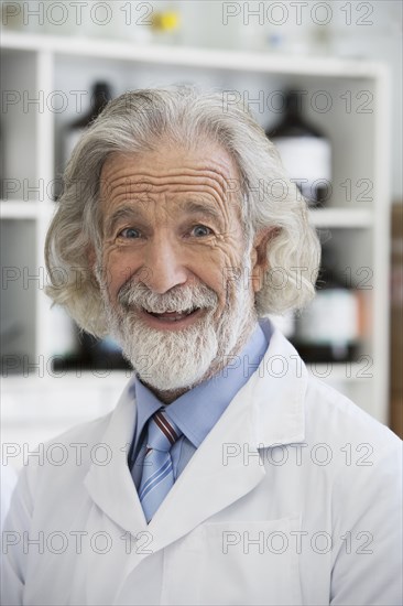 Senior Caucasian scientist smiling in lab