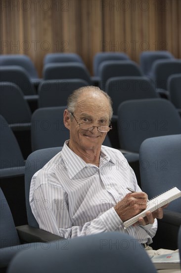 Senior Caucasian student working in classroom