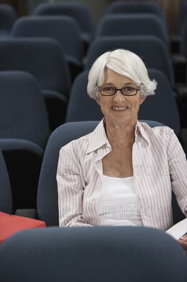 Senior Caucasian student sitting in classroom