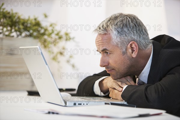 Businessman working at desk in office