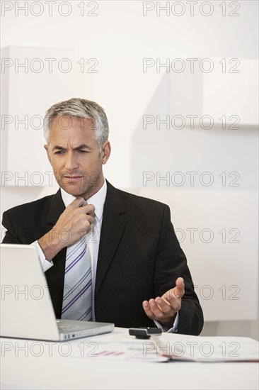 Businessman working at desk in office