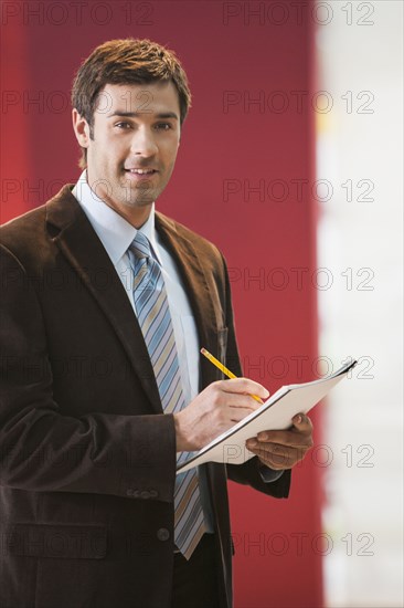 Businessman taking notes in office