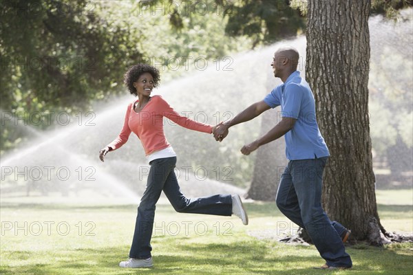 Couple running in park