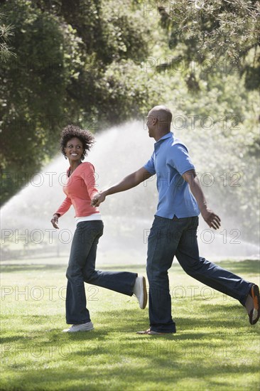 Couple running in park