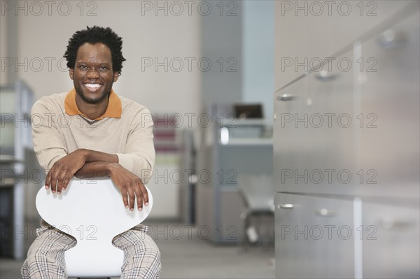 African American businessman smiling in office