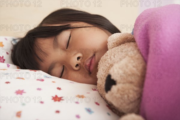 Chinese girl sleeping in bed