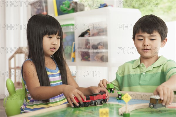 Children playing with train set