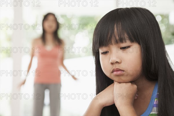 Girl sitting with chin in hands
